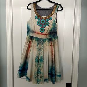 Beautiful dress with beaded neckline and sheer back cutout